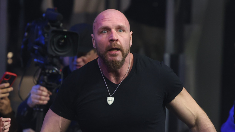 Jon Moxley looks stunned while looking into the ring from behind the barricade during an episode of "AEW Dynamite."