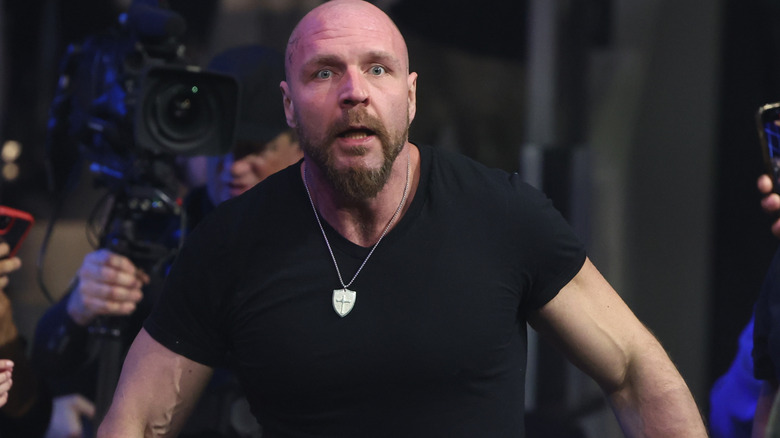 Jon Moxley looks stunned while looking into the ring from behind the barricade during an episode of "AEW Dynamite."