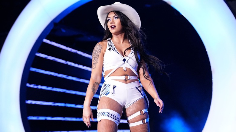 Skye Blue poses in an all-white set of gear, complete with a white cowboy hat.