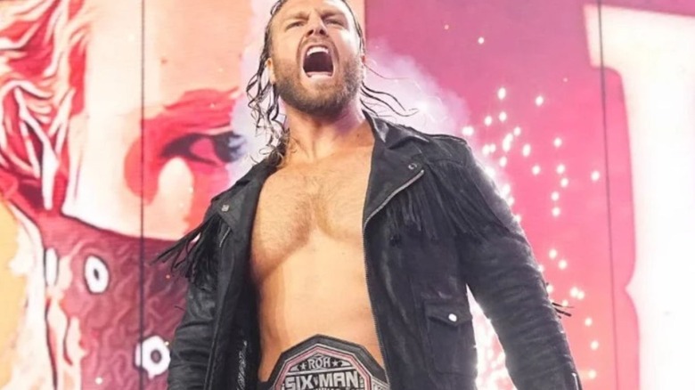 Adam Page appears on the stage of "AEW Dynamite" wearing an ROH title.