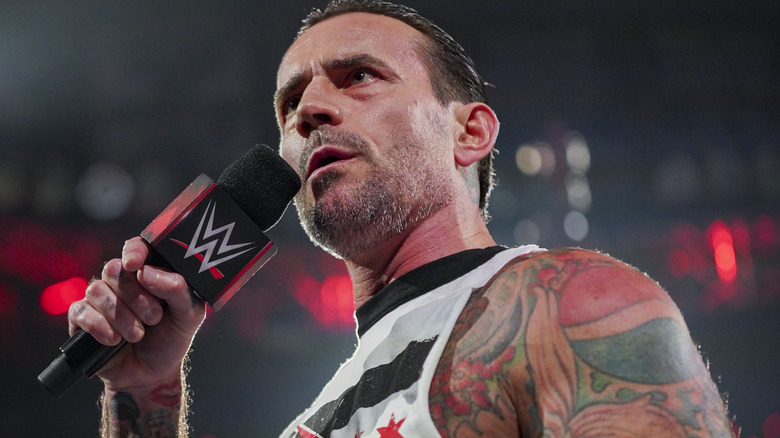 CM Punk with a microphone