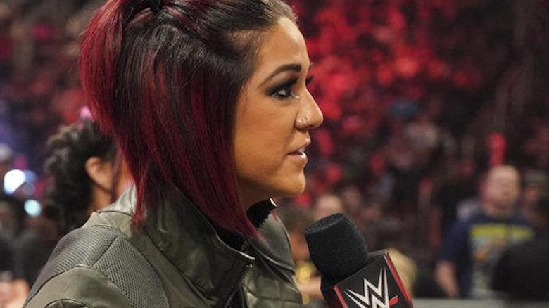 Bayley with a microphone