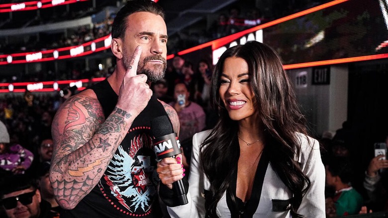 CM Punk and Jackie Redmond during an interivew in the crowd on WWE Raw