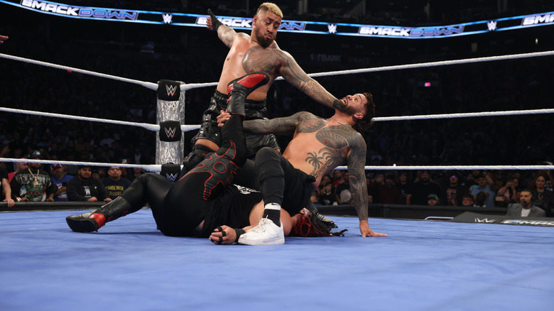 The Bloodline and Jey Uso on the new WWE SmackDown ring mat