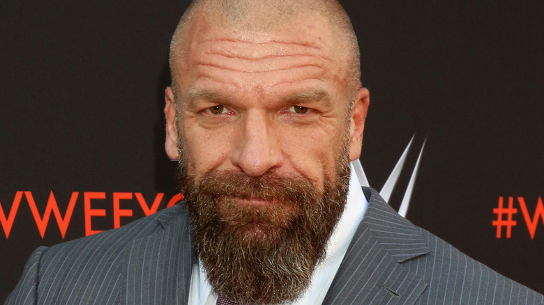 Triple H grinning