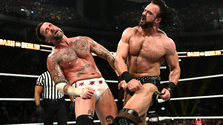 Drew McIntyre punching CM Punk