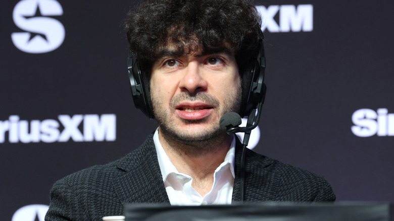 Tony Khan wearing a headset