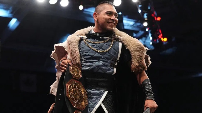 El Hijo del Vikingo, with AAA Mega Championship in hand, looks out into the crowd with a smile before a match on 