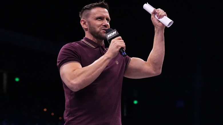 Nigel McGuinness brandishes the contract for his match