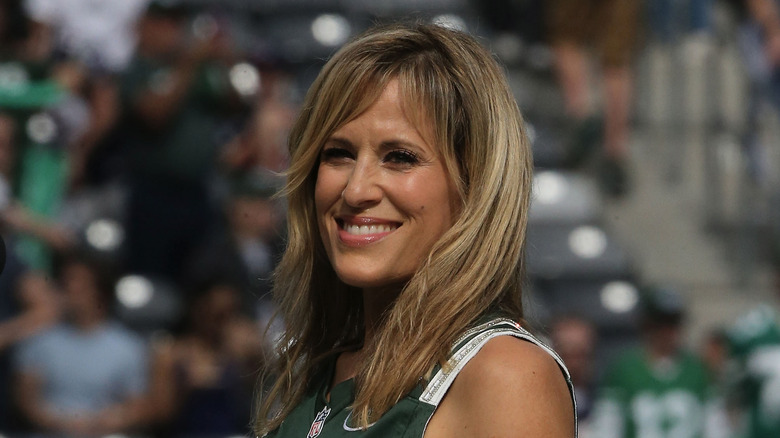 Lillian Garcia smiles before singing the national anthem at a Jets game