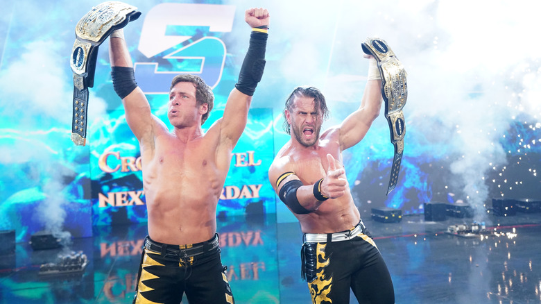 MCMG celebrate with their newly won tag team titles