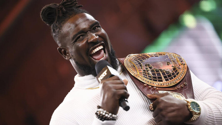 Oba Femi cackles while holding the North American Title