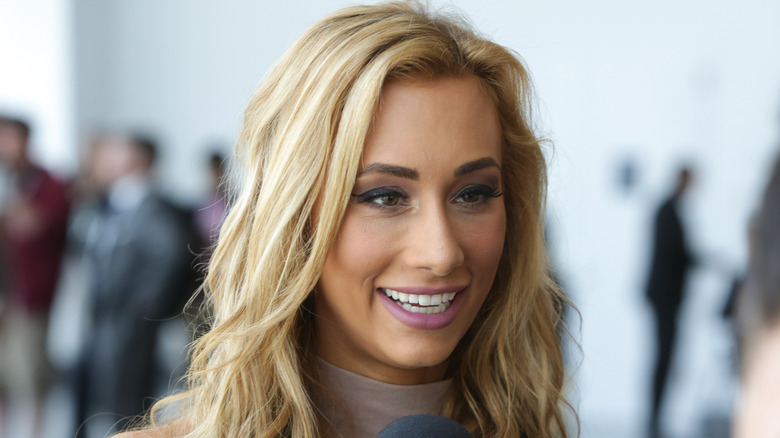 Carmella speaking with the media