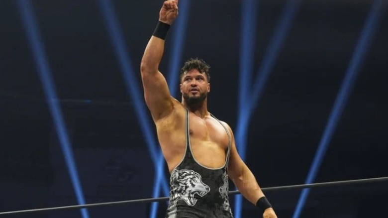 Wardlow raises his hand in victory in the ring during an episode of AEW TV.