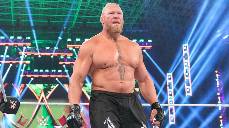 Brock Lesnar licks his lips during an appearance in a WWE ring.