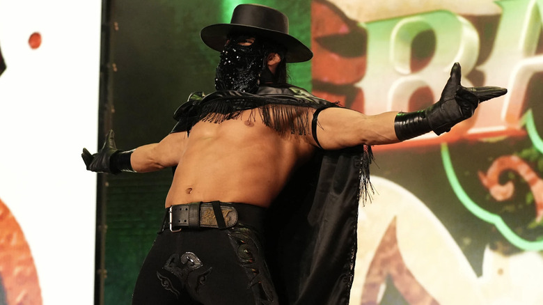 Bandido poses during his entrance on "AEW Dynamite"