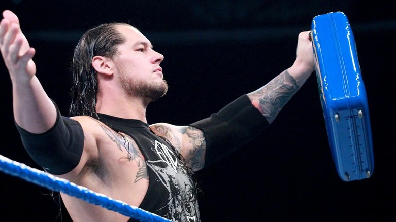 Baron Corbin holds up the Money In The Bank briefcase