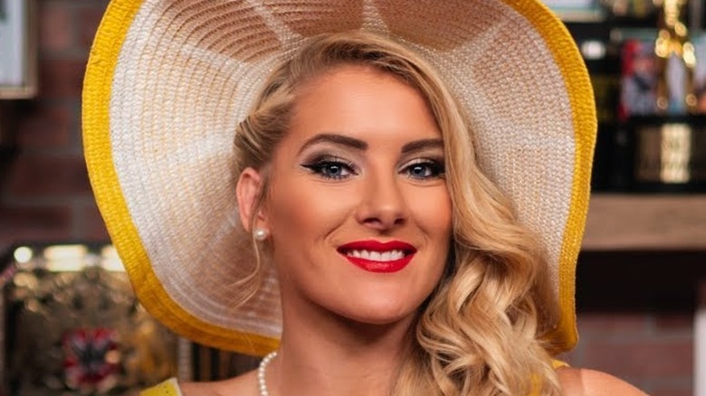 Lacey Evans poses with a hat on