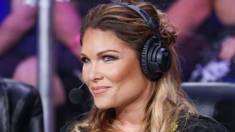 Beth Phoenix wearing her headset on commentary