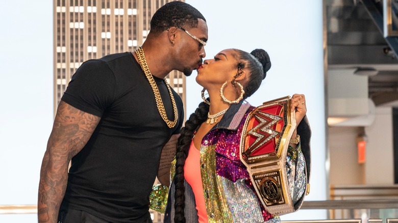 Bianca Belair and Montez Ford kissing