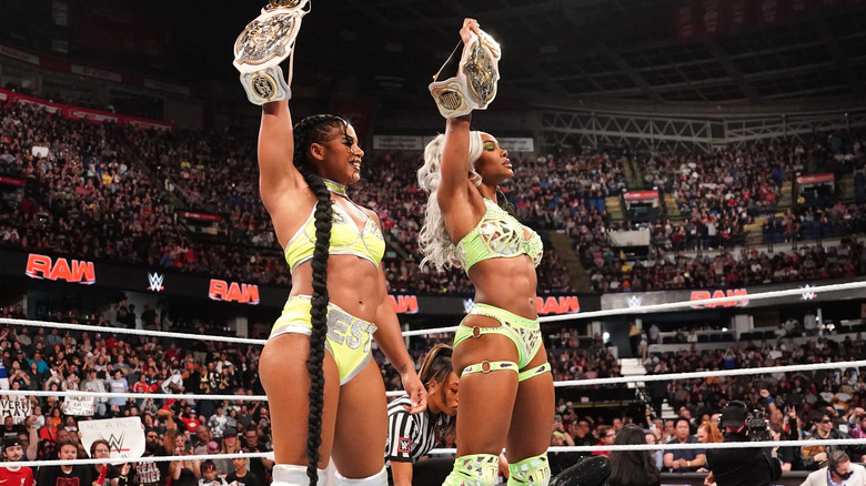 Bianca Belair Jade Cargill hold up tag titles