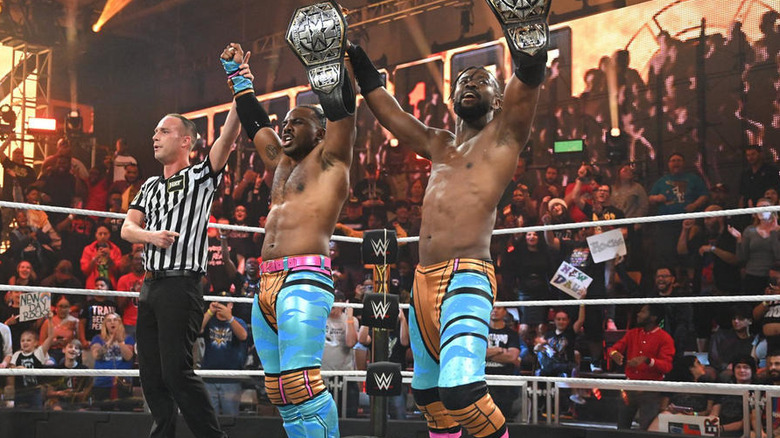 The New Day holding their titles high