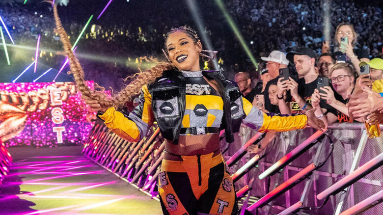 Bianca Belair smiles as she makes her entrance down the ramp.