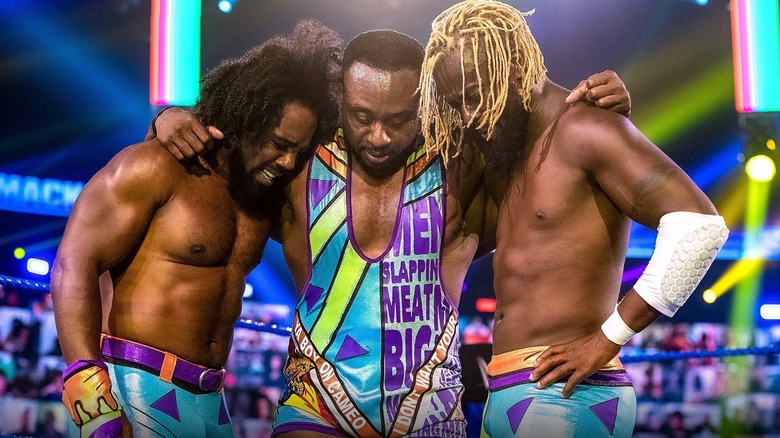 Xavier Woods, Big E, and Kofi Kingston embrace on "WWE SmackDown"