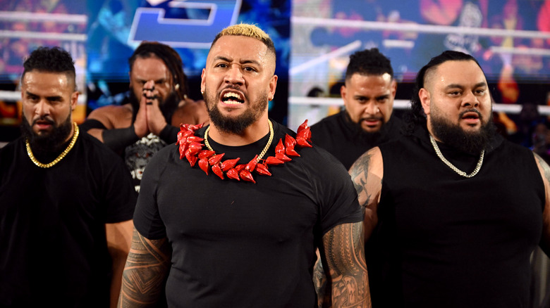 Tama Tonga, Jacob Fatu, Solo Sikoa, Tonga Loa and Bronson Reed of the new Bloodline yell back at the ring during WWE SmackDown at Fiserv Forum on November 15, 2024 in Milwaukee, Wisconsin.