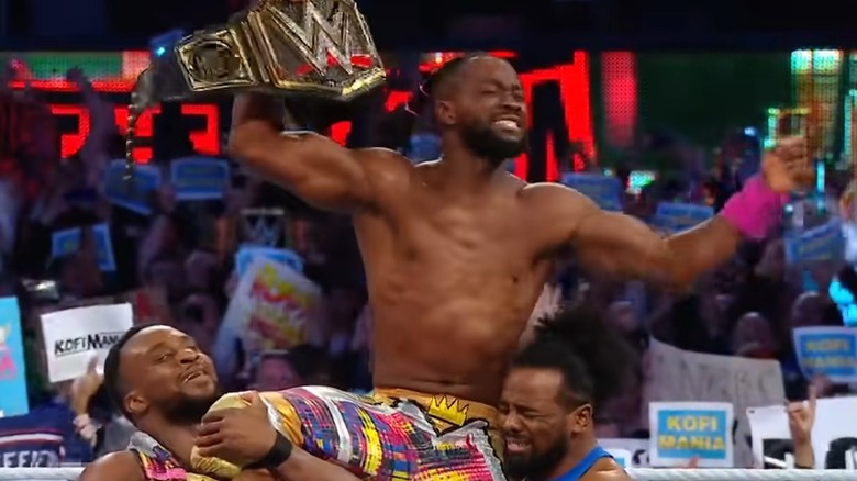 Big E and Xavier Woods lifting Kofi Kingston on their shoulders