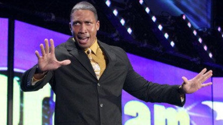 Former WWE talent Abraham Washington addresses the crowd on stage during an "Abraham Washington Show" segment on WWE TV.