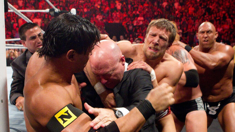 Daniel Bryan participates in a ringside brawl alongside Nexus stablemates Ryback and Justin Gabriel on an episode of "WWE Raw" in 2005.