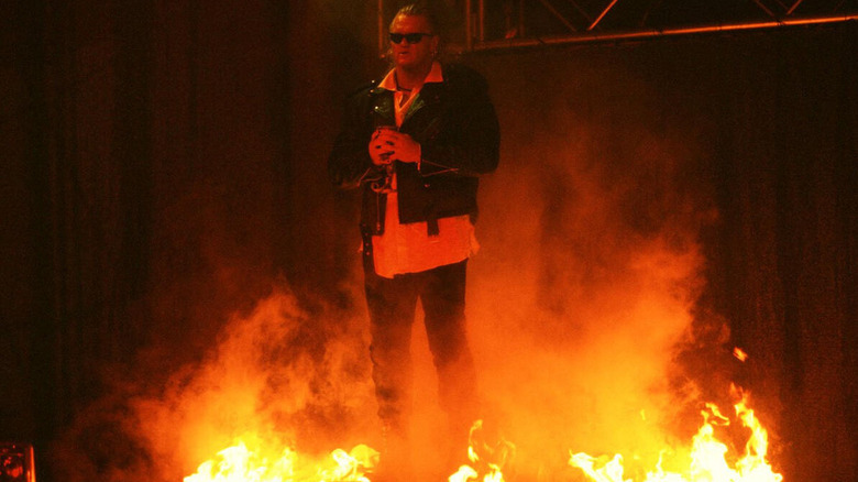 Gangrel makes his entrance, surrounded by fire on the stage, before a match in WWF.