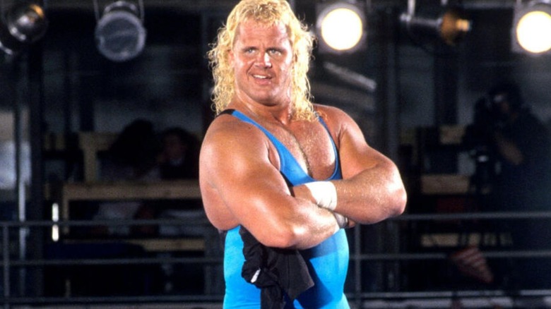 "Mr. Perfect" Curt Hennig poses in the ring, his arms crossed over his chest, before a match.