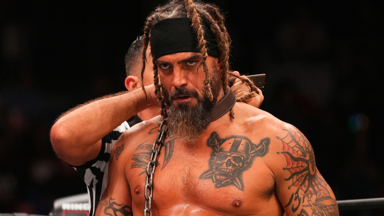 Jay Briscoe wearing dog collar