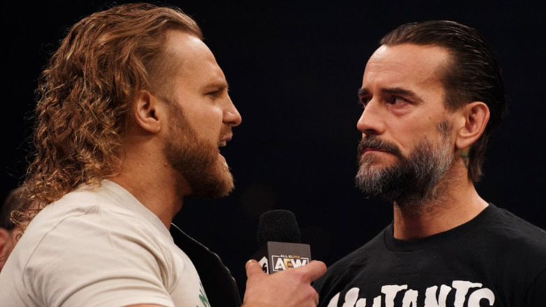 Hangman Page talking to CM Punk