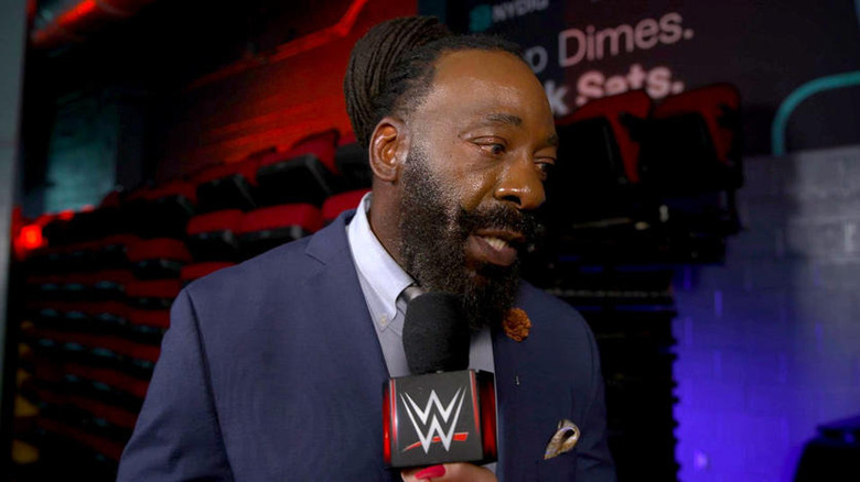 Booker T being interviewed backstage at a WWE event