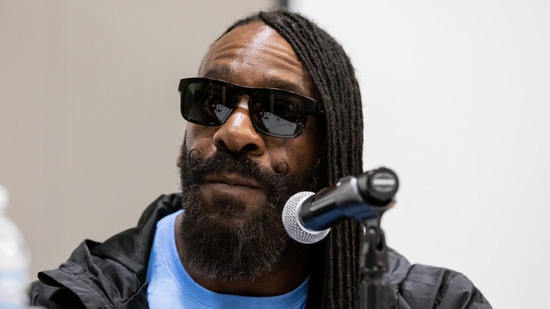 Booker T at a press conference sunglasses