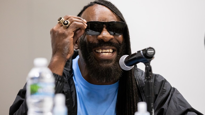 Booker T wearing sunglasses and smiling