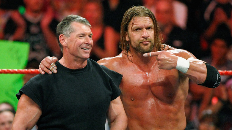 Triple H points at Vince McMahon