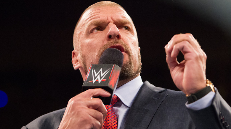 Triple H Speaking Into Microphone