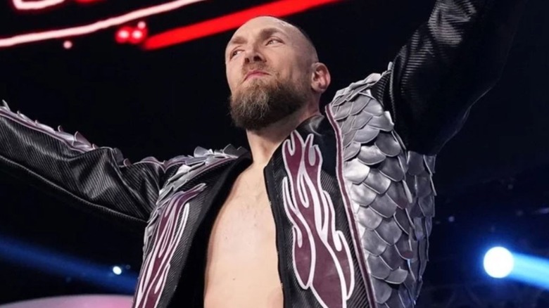 Bryan Danielson stands on the turnbuckle before a match on AEW programming.