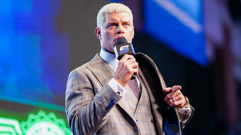 Cody Rhodes talking into a microphone