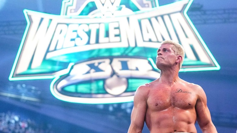 Cody Rhodes stands on the turnbuckle in front of the WrestleMania 40 sign after winning the 2024 Royal Rumble.