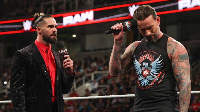 Seth Rollins and CM Punk in the ring