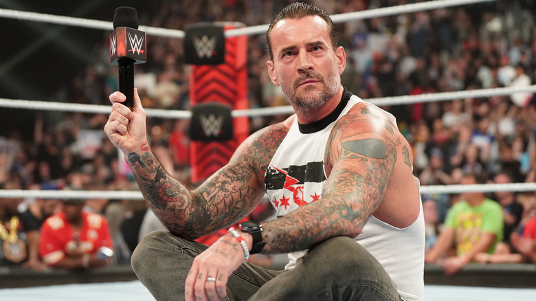 CM Punk sitting in the ring on WWE Raw