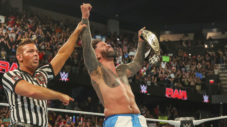 Jey Uso celebrating with WWE Intercontinental Championship