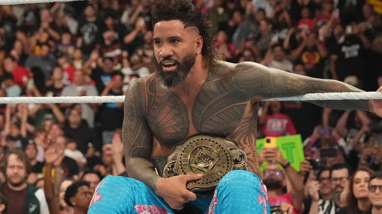 Jey Uso holding the WWE Intercontinental Championship