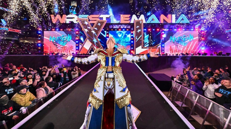 Cody Rhodes stands on the stage during his grand entrance with fireworks and pyro at WrestleMania 40.