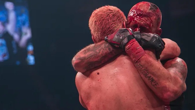 Cody and Dustin Rhodes embrace after a bloody battle at Double Or Nothing 2019.